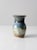 This is a vintage studio pottery vase. Signed by the artist, the hand-crafted vase features a beautiful blue and green...