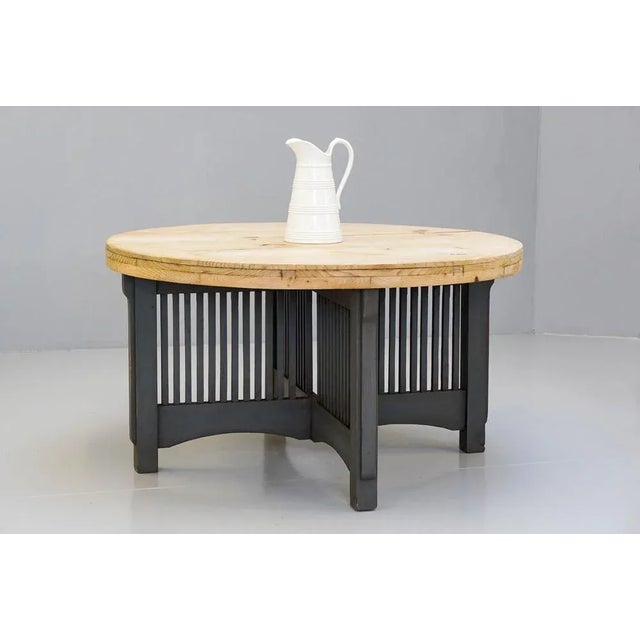 Circular pine centre table with repainted base.