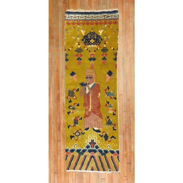 Mid-20th century Chinese runner with an emperor on a mustard color ground. This piece looks to be a fragment from a larger...