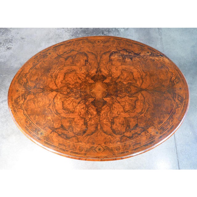 Victorian table in wood and briar, with inlaid and threaded oval top. Origin england period 1800 materials wood and briar...