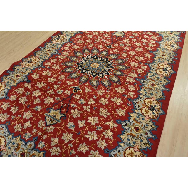 An authentic vintage traditional Kashan rug hand-knotted with fine wool and natural dyes. This intricately woven rug...