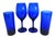 I have always been a lover of blue glass. These are 2 stemmed wine glasses and 2 6" tall high ball glasses. Probably...