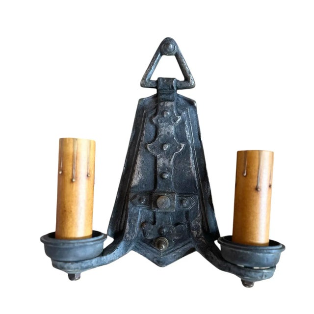 Rare details adorn these hammered sconces. Geometric details add to the strength of these cast iron pewter wall sconces.