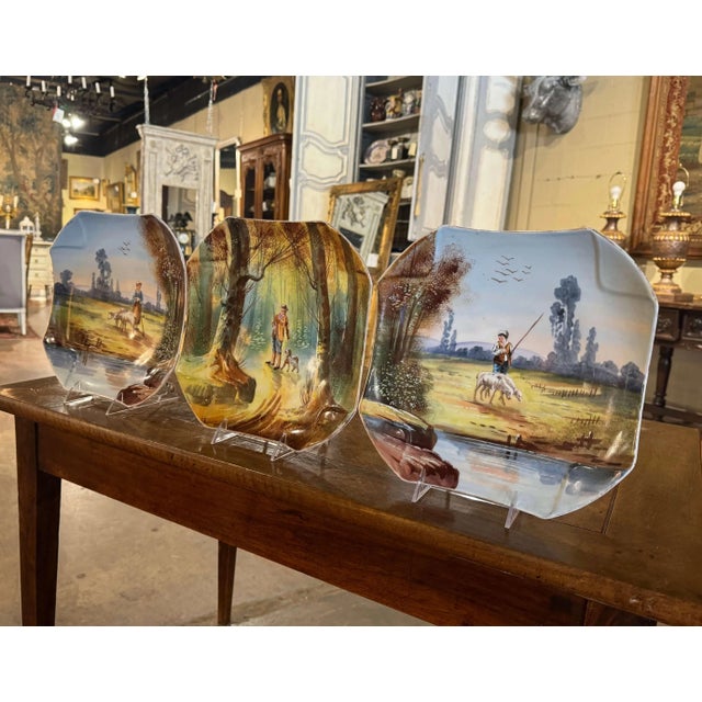 Decorate a wall or a shelf with this colorful antique wall platters. Crafted in France circa 1950, and made of porcelain,...