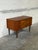 Beautiful vintage Danish Modern small dresser crafted in teak, featuring clean Scandinavian lines, sculptural recessed...
