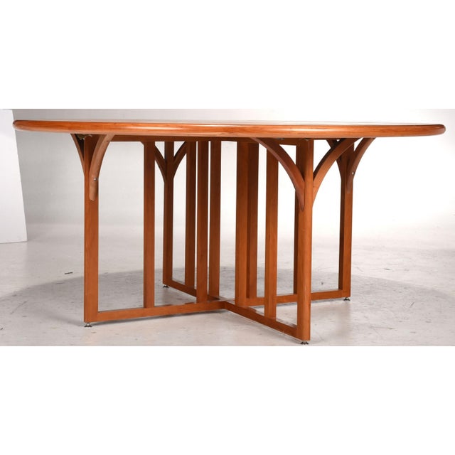 20th century, the top in laminated cherry with cruciform design, with brass line and cherry inset inlay, on an open X form...