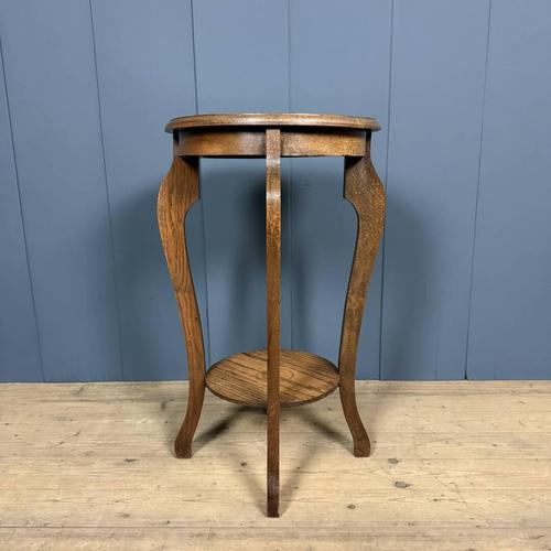 This large, elegant oak planter table dates back to the 1950s. We've cleaned and waxed it. It also makes a great side table.