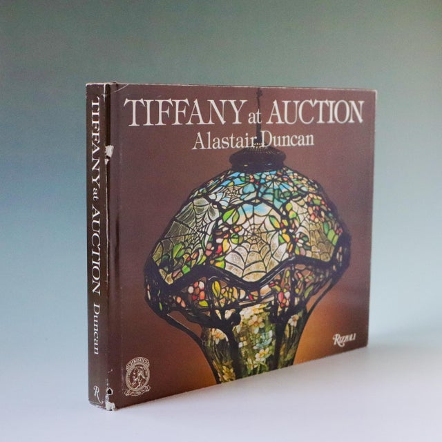 A substantial and beautifully illustrated reference on the work of Tiffany Studios, Tiffany at Auction by noted...