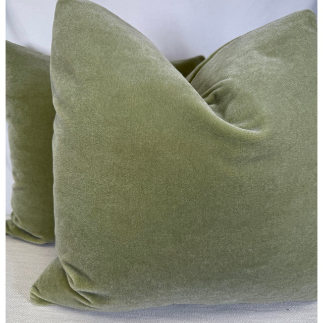 Custom pair of 22" pillows covered in a celadon colored plush mohair. These pillows have tapered corners to prevent dog...