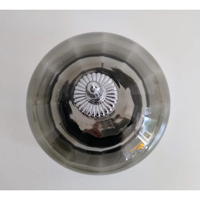 This sculptural flush mount ceiling light was produced by Glashütte Limburg in Germany during the 1970s. The elegant...