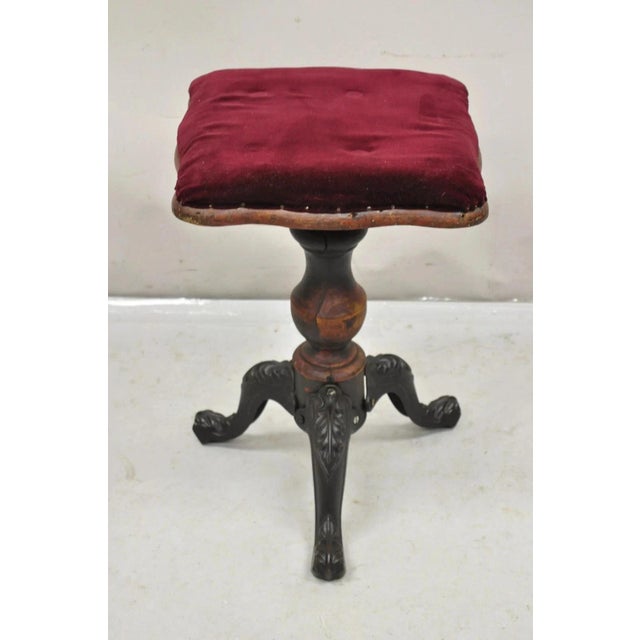 Antique American Victorian Cast Iron and Wood Tripod Pedestal Base Adjustable Piano Stool. Circa Late 19th Century....