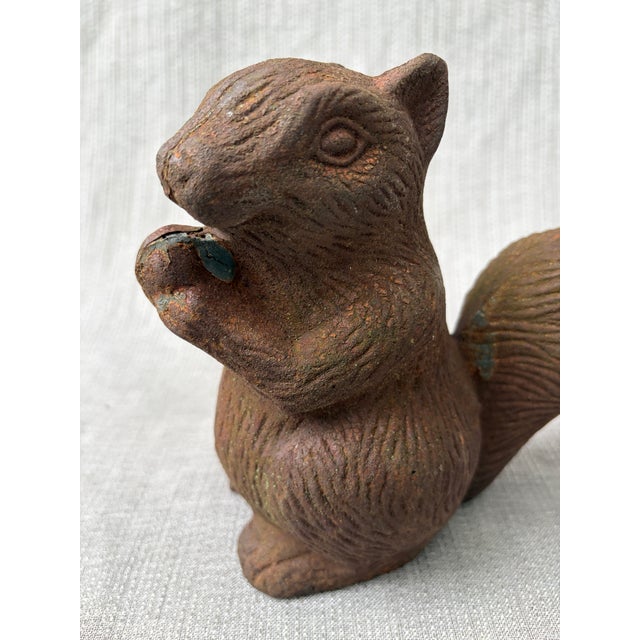Sweet, heavy, vintage rusted cast iron squirrel eating and acorn statue. Great garden ornament or doorstop. Rusty patina,...