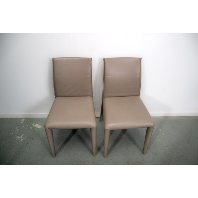 Designed by Mario Bellini in 2001 the Vol Au Vent chair, with its single-material leather or fabric upholstery, can be...