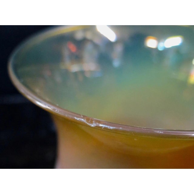 This unusual 20th century art glass vase is beautifully designed in various hues of amber & burnt orange. It features a...