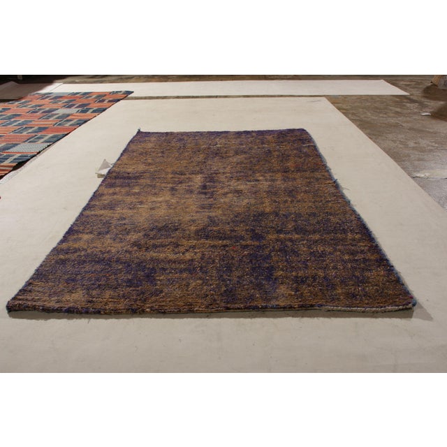 Handmade with a lustrous silk, this early modern rug remarks an experiment in exceptionally dyed yarn inspiring one of our...