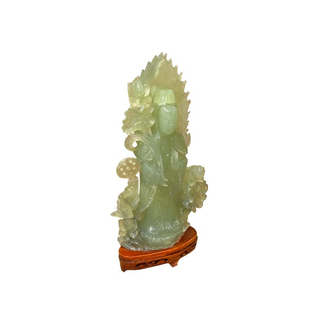 The Light Green Jade Color Stone Chinese Lotus Standing Guan Yin Bodhisattva Statue is a captivating and graceful work of...