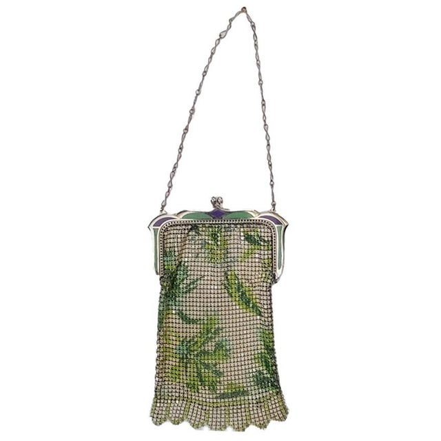 1920's At Deco Flapper mesh purse. It features a kiss-lock clasp and a distinctive "Vandyke" bottom edge. The enamel frame...