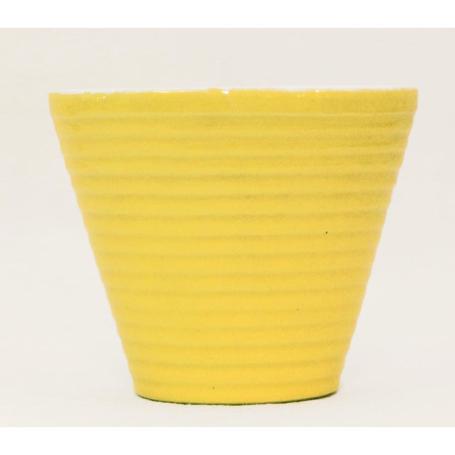 Pair of Art Deco Ceramic Flower Pots Two Art Deco cactus flower pots, circa 1925. Ribbed surface. Yellow exterior, white...