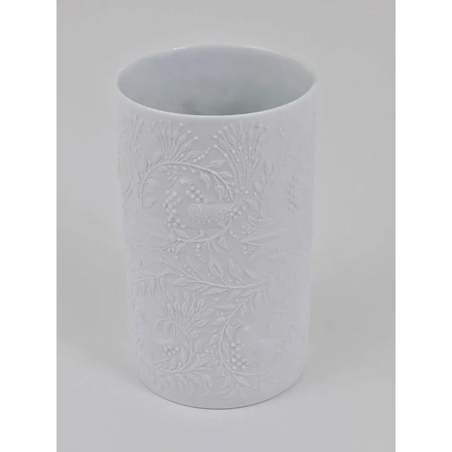 A beautiful white matte relief op-art porcelain vase from the 1960s, designed by Bjorn Wiinblad and executed by Rosenthal...