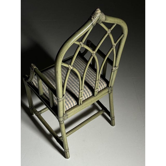 Bamboo armchair. Presumably from England, circa 1980. This chair is olive green in color. Dimensions: 114H x 53W x 56D cm...