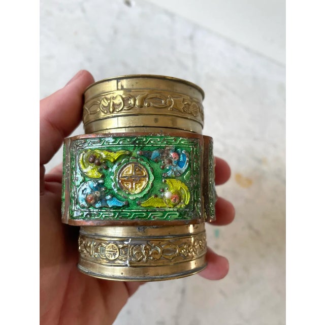 Beautiful antique Chinese brass and enamel canister in blue, green and chartreuse. Stamped "China". Likely used to store...