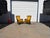 A striking pair of vintage Mid-Century Modern Hollywood Regency high-back fireside chairs, combining elegant proportions...