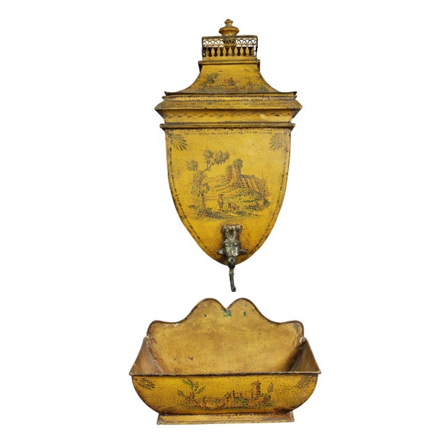 With a removable cover with gallery and finial, tapered body with spigot lacking handle, all above the rectangular basin.