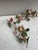 French Small Pair of Wrought Iron Flowers Sconces. H / 10 inches. W / 4.5 inches. D / 4 inches.