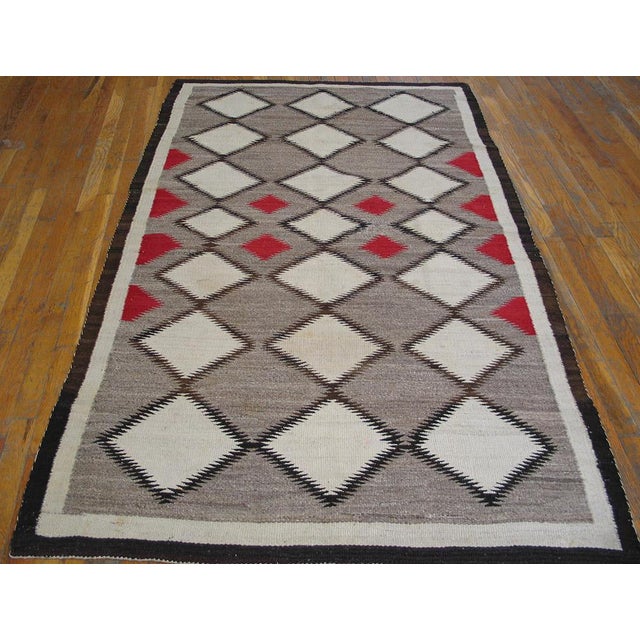 Flat Weave Allover Geometric 1930s Wool Gray Antique Rectangle Rug, Circa Date: 1930s. This exceptional piece of textile...