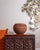 Dimensions: 12"D × 8.5"H Sculptural terracotta planter with a low, rounded form and deeply textured horizontal ribbing....
