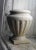 Pair of vintage, Neoclassical style white Carrara marble fluted jardinière planters. Originating from Italy in the...