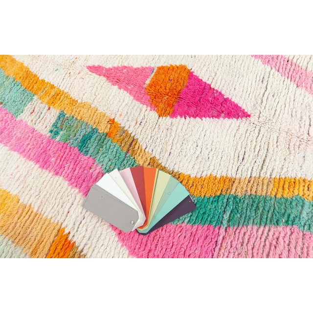 Brimming with charisma and expressive flair, this modern Moroccan rug is a radiant celebration of tribal artistry fused...