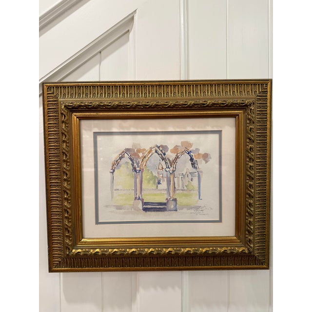 A charming original 1995 watercolor depicting the cathedral ruins at St. Andrews, Scotland. The artist captures the arches...