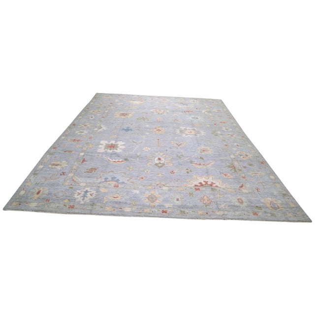 Hand-knotted with care using traditional rug-making techniques, this wool rug blends timeless craftsmanship with a modern...