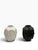 A striking pair of sculptural ceramic vases, each molded with overlapping serene faces that shift as you move around the...