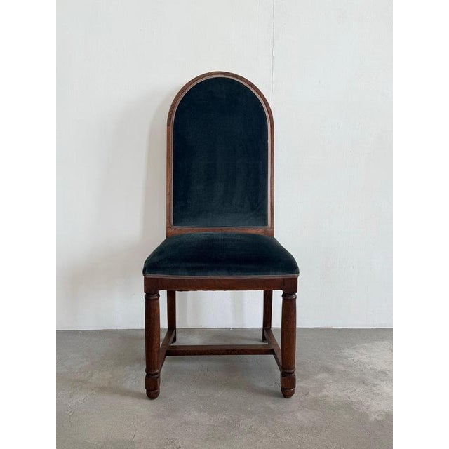 A striking Dutch oak side chair executed in the manner of the Art Deco, Amsterdam School, dating from the 1920s. The chair...