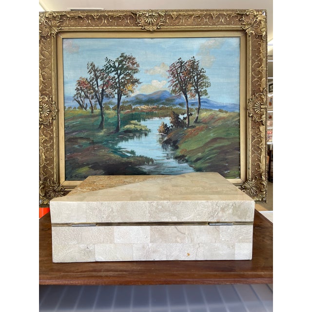 This vintage decorative box is crafted from what is possibly tessellated stone in a warm beige and ochre palette, accented...