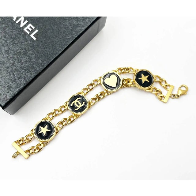 Chanel Vintage Gold Plated CC Heart Star Black Coin Bracelet *Marked 01 *Made in France *Comes with the original box -It...