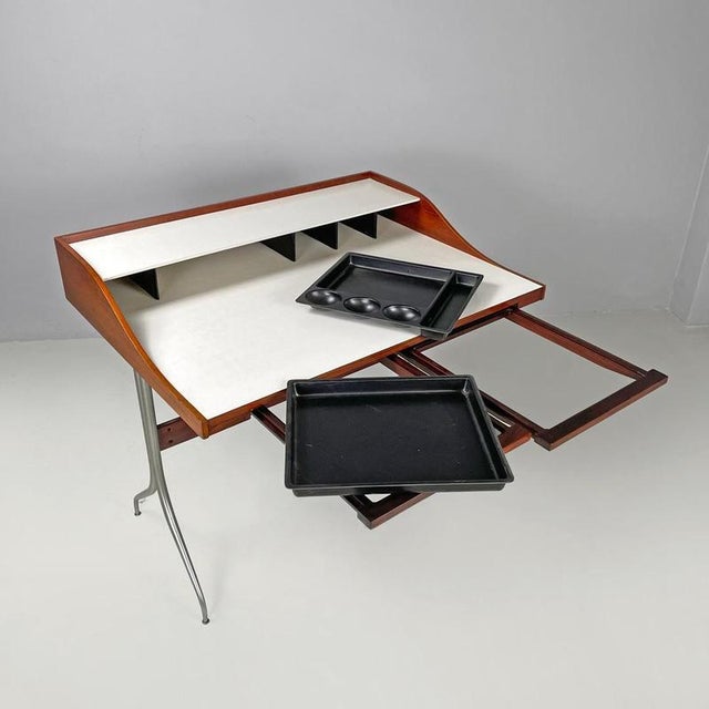 American mid-century modern wood laminate desk George Nelson Herman Miller 1960s Desk or writing desk in wood and metal....