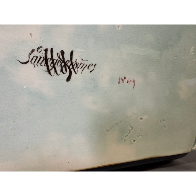 A fine Sarreguemines earthenware jardinière, decorated with poppy flowers, with a scalloped shape, two handles, and four...