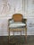 An elegant antique French Louis XVI style bergère chair, showcasing refined neoclassical design and exceptional...