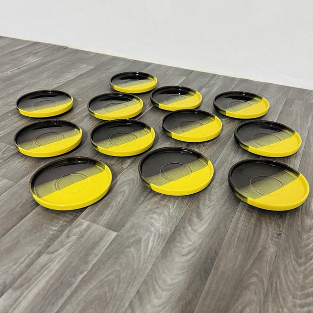 Fascinating vintage dining set consisting of 12 ceramic plates produced by Ceramiche SIC in the 1970s. The design is...