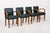 This exceptional set of four antique Art Deco leather upholstered dining chairs circa 1930 feature an elegant and unique...