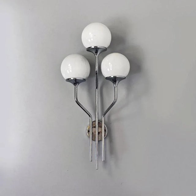 Italian Mid-Century Modern chromed steel and glossy glass wall lamp, 1970s Single applique or three-light wall lamp, with...