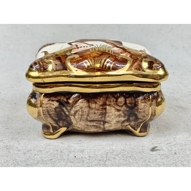 Beautiful vintage ceramic lidded box. Originally made in Belgium. Features a deer with ornate gold detailing on the...