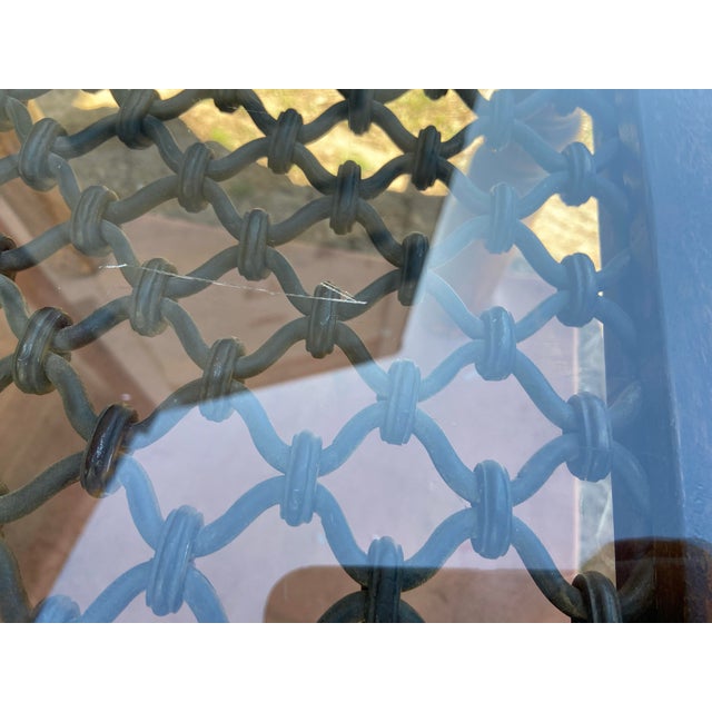 Vintage Indian inspired modern rustic glass and metal side end table with wrought iron inserts , surface glass has minor...