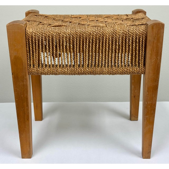Vintage mid century style wood stool with woven rope top in a tight herringbone pattern. Rope cord drops 5"H on all sides....