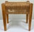 Vintage mid century style wood stool with woven rope top in a tight herringbone pattern. Rope cord drops 5"H on all sides....