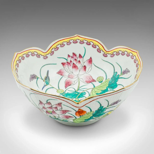 This is a vintage leaf form fruit bowl. A Chinese, ceramic decorative dish with lotus flower motif, dating to the Art Deco...