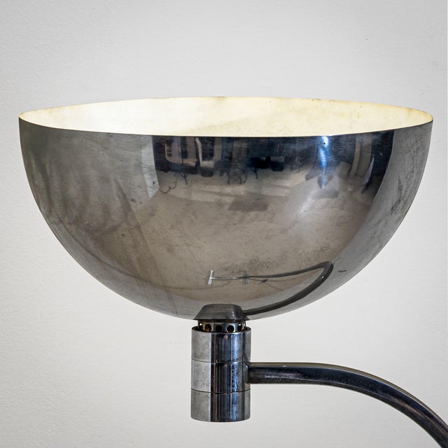 Floor lamp model AM/AS in chrome-plated steel with a hemispherical shade directing the light upward. Designed in 1969 by...